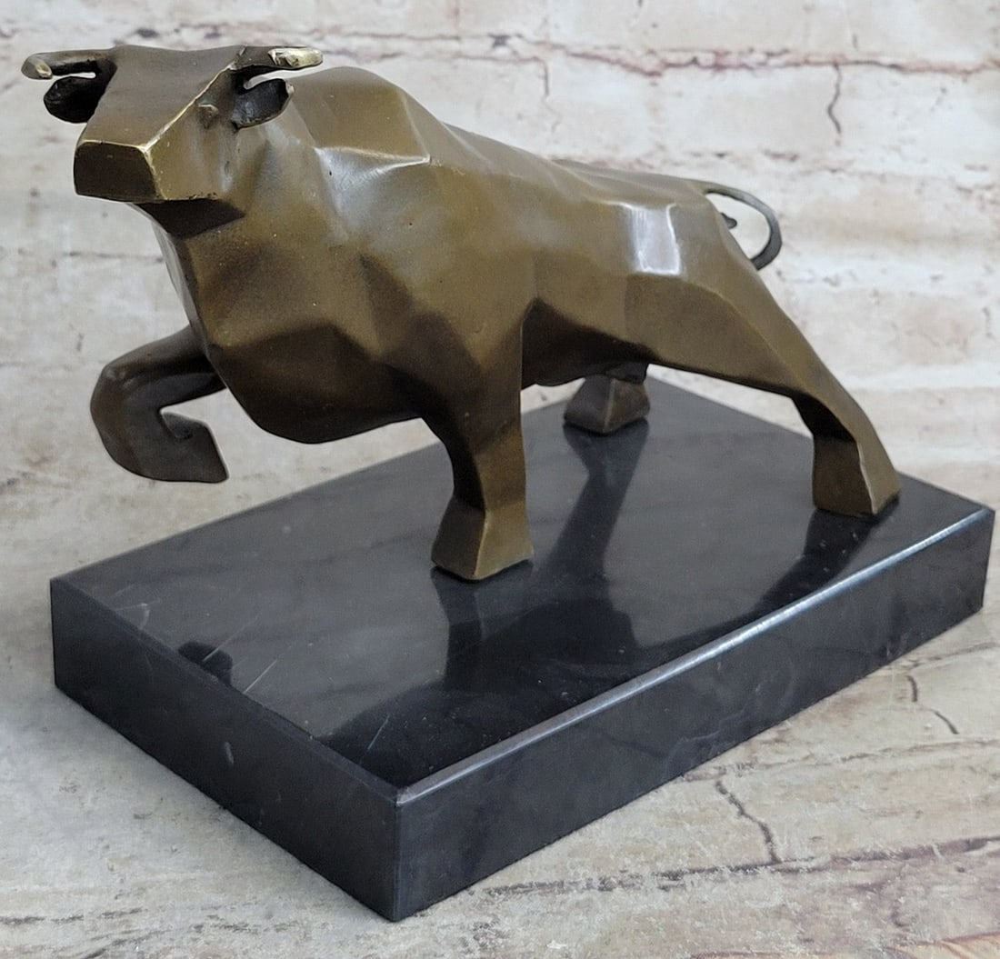 ART DECO HOTCAST BRONZE BULL MOUNTED ON A BLACK MARBLE BASE. SIGNED NICK DEAL: Condition: This sculpture is in perfect condition. Bronze Dimensions with Marble Base: Height 8" x Width 12"Marble Dimensions: 8.5" X 5".Height without base: 7 " Weight : 10 LBSInventory: 32AL55923Tho