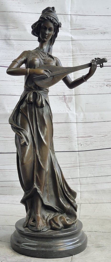 Jean Patoue`s Masterpiece: Handmade Bronze Statue of a Female Banjo Player: Condition: This sculpture is in perfect condition Bronze Dimensions with Marble Base: Height 20" X Width 8" Marble Dimensions: Diameter 6" Height without base:18.5" Weight:16 LBS Inventory:31YRD558811