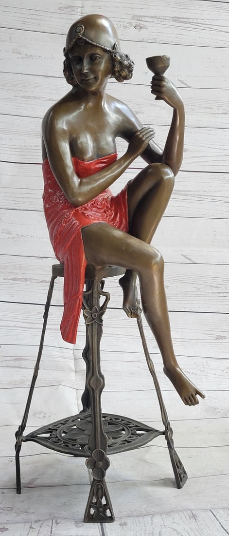 100% Bronze lady holding champagne cup on stool statues Art Nouveau Sale: Condition: This sculpture is in perfect condition. Bronze Dimensions :Height 21.5" x Width 6.5" Weight : 12 LBS Inventory:71EP266B12017 Any fan of the Roaring 20's, Jazz and F. Scott Fitzgerald will a