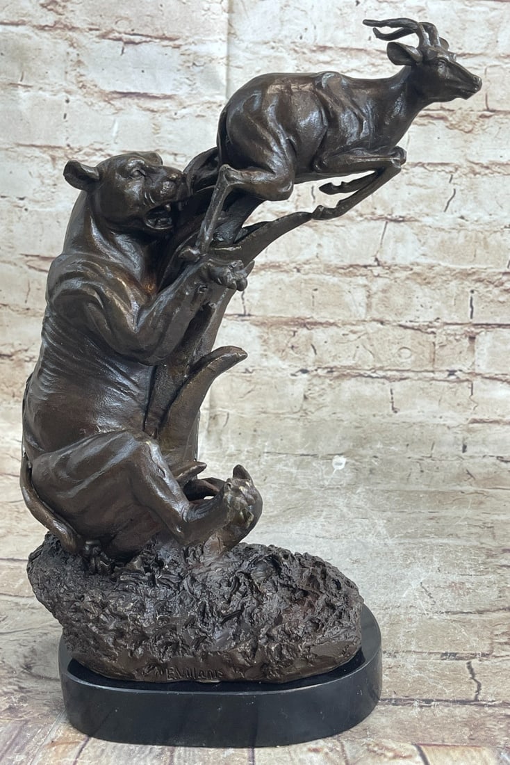 Confrontation between Mountain Lion and Gazelle Hot Cast Bronze Sculpture: Condition: This sculpture is in perfect condition. Bronze Dimensions with Marble Base: Height 12 1/2" x Width 11" Marble Dimensions: Diameter 6 1/2" Height without base: 11 1/2" Weight : 10 LBS Invent