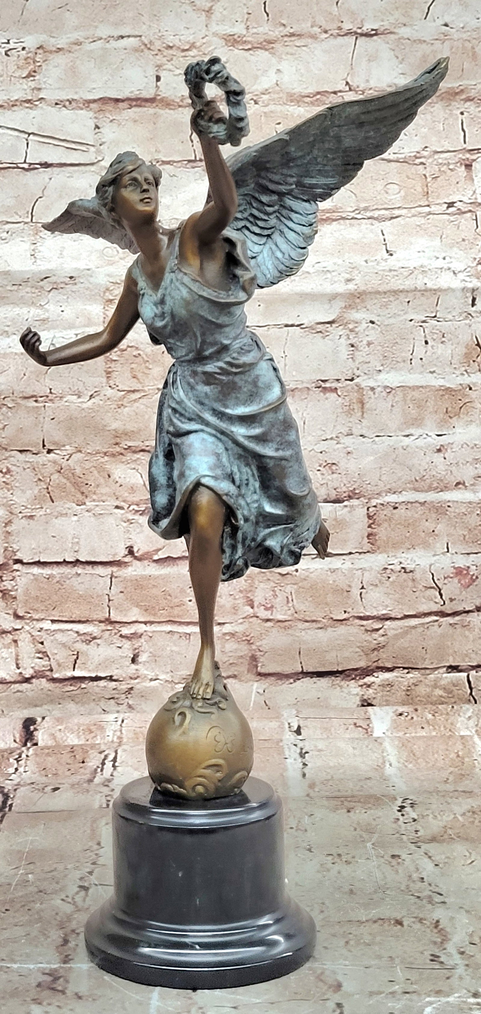 Classic Bronze Winged Victory Nike Sculpture Laurel Wreath Marble Statue: Condition: This sculpture is in perfect condition. Bronze Dimensions with Marble Base: Height 15" X Width 9" Marble Dimensions: Diameter 4" Height without base:12" Weight:8 LBS Inventory:61EP873S8016 