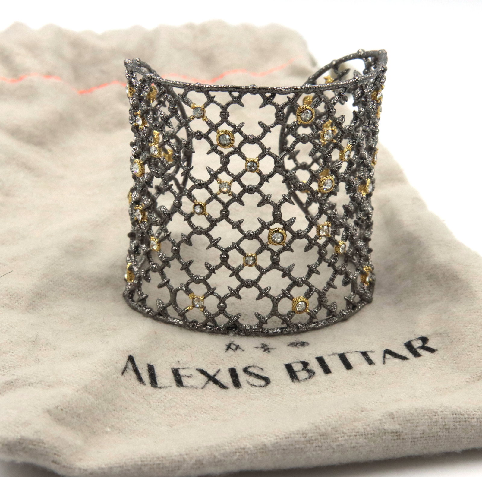 Alexis Bittar plated crystal wide cuff bangle: Alexis Bittar plated crystal wide cuff bangle. The total weight of the bangle is 29.9 grams.