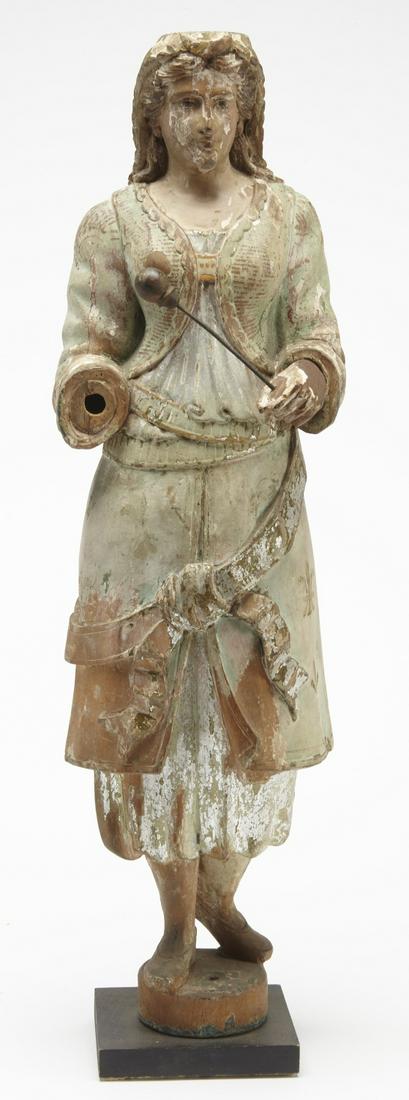 Carved Carousel Band Organ Figure: Carved carousel band organ figure. Circa 1890. H 25". Appears to have original paint. One hand missing.