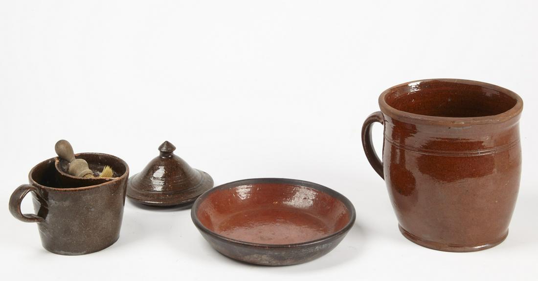 Redware Shaving Mug, Handled Jar, Plate: American redware shaving mug: H w/cover 6" approx. together with a handled Jar: H 6-3/4", Dia. 6-3/4"; and plate: DIa. 6-3/4". 19th century. Susie and Richie Burmann Collection.