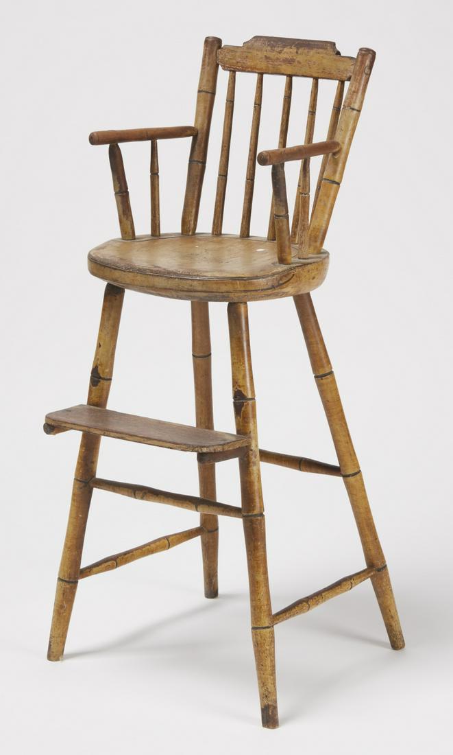 Windsor High Chair: Step down Windsor high chair in original cream-yellow paint with black highlights. New England, circa 1820. Overall height 34-1/2". Excellent condition. Foot rest moved at some point in it's history.