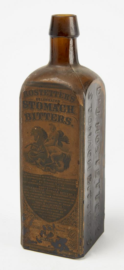 Bitters Bottle with Original Label: Antique bitters bottle with original label. H 9-1/4", W 2-3/4", D 2-1/2".