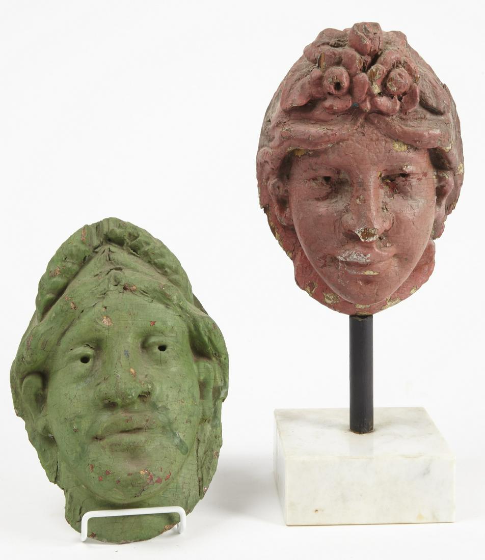 Pair of Carved Carousel Heads: Pair of carved and painted carousel heads. Circa 1900. Height of heads 9". Each in old painted surface complete with wall mounting plates on the back. One with contemporary base.