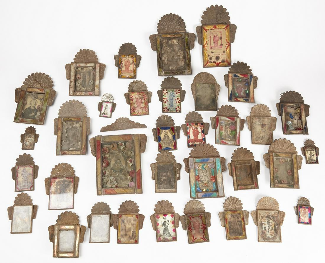 Large Lot of Antique Mexican Tin Nichos: Large lot of approx 32 antique Mexican tin nichos. Many with reverse painted glass incorporated in frames. Sizes range from H 4" -11". One with detached crest.