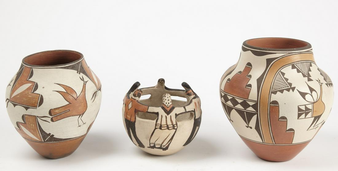 Three Native American Pottery Jars: 3 Native American pottery jars, 20th century, including 2 Zia ollas, larger signed Elizabeth Medina. H 10" and 9" and vessel with figures H 6-1/4" D 7". Excellent condition, minor imperfections.