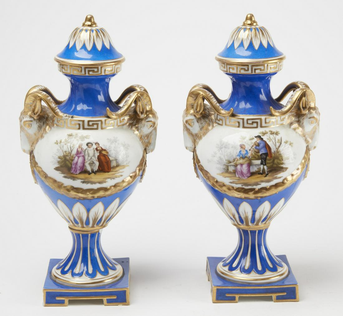 Pair of Fine Porcelain Urns marked AR: Pair of fine porcelain urns marked AR. H approx 16-1/2". One with chips and imperfections as seen in the images.