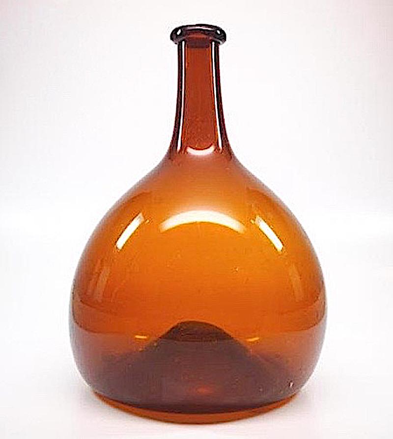 Early Amber Free Blown Bottle: Midwestern Glob. Ohio ca. 1840 perfect condition. H 10-1/2". Dia 7-1/4". Minor interior residue. US shipping $25 Courtesy John Sideli Art & Antiques JohnSideliFineArt.com.