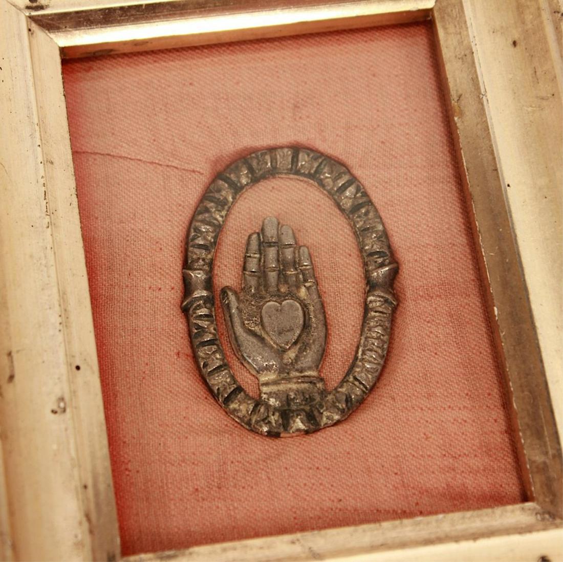 Heart-in-Hand Odd Fellows Pendant: Heart in hand Odd Fellows pendant mounted in frame, c. 1860s Antique mid-19th century casting (likely silver) of the Odd Fellows heart in hand framed in a period lemon gold molding, c. 1860s. The mott