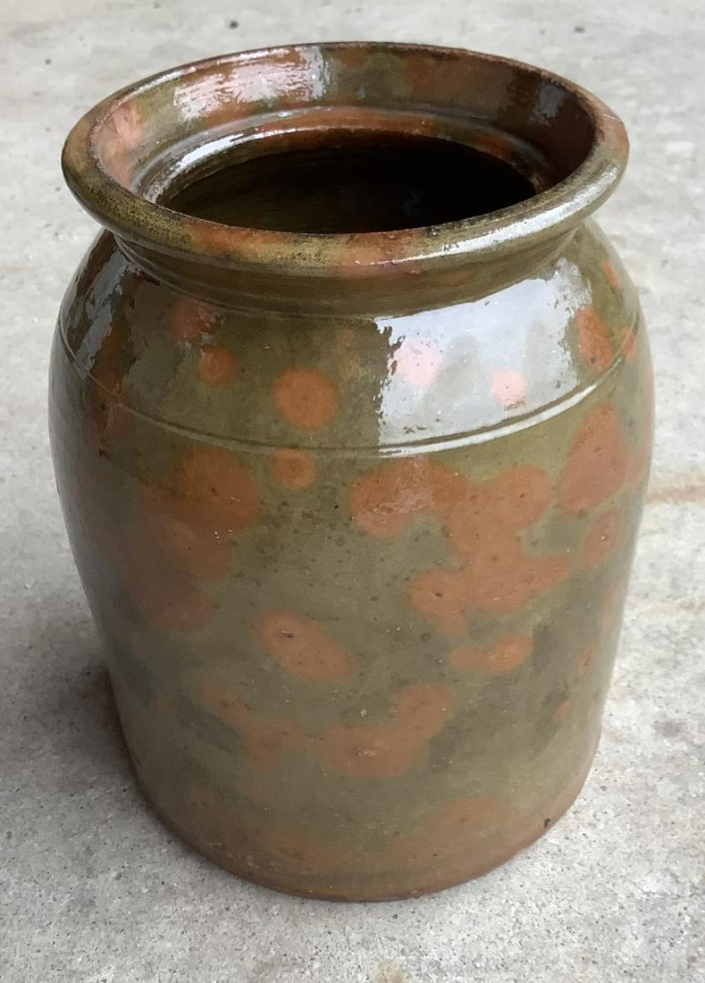 19th Century New England Redware Jar: New England redware jar. 19th century. Slight overfiring of glaze on small area near base (see photo). Otherwise, excellent condition. 8 “ tall. 6 “ in diameter at base. 5 1/4“ in diameter at to