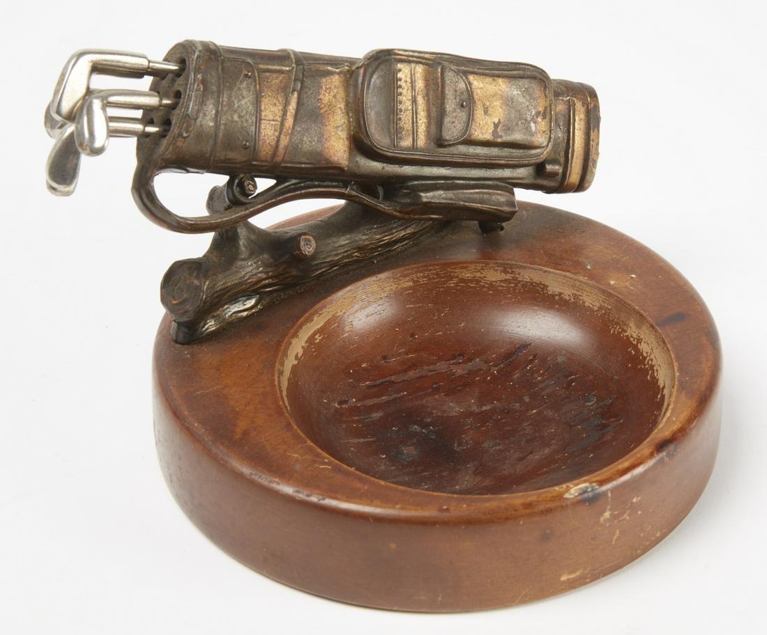 Vintage Golf Bag Ashtray: Interesting golf bag ash tray. The 6 steel clubs pull out for swizzle sticks. Golf bag is bronzed spelter, swizzle sticks are steel, base is wood. Bel Art Modern Giftware label on the bottom. L of gol