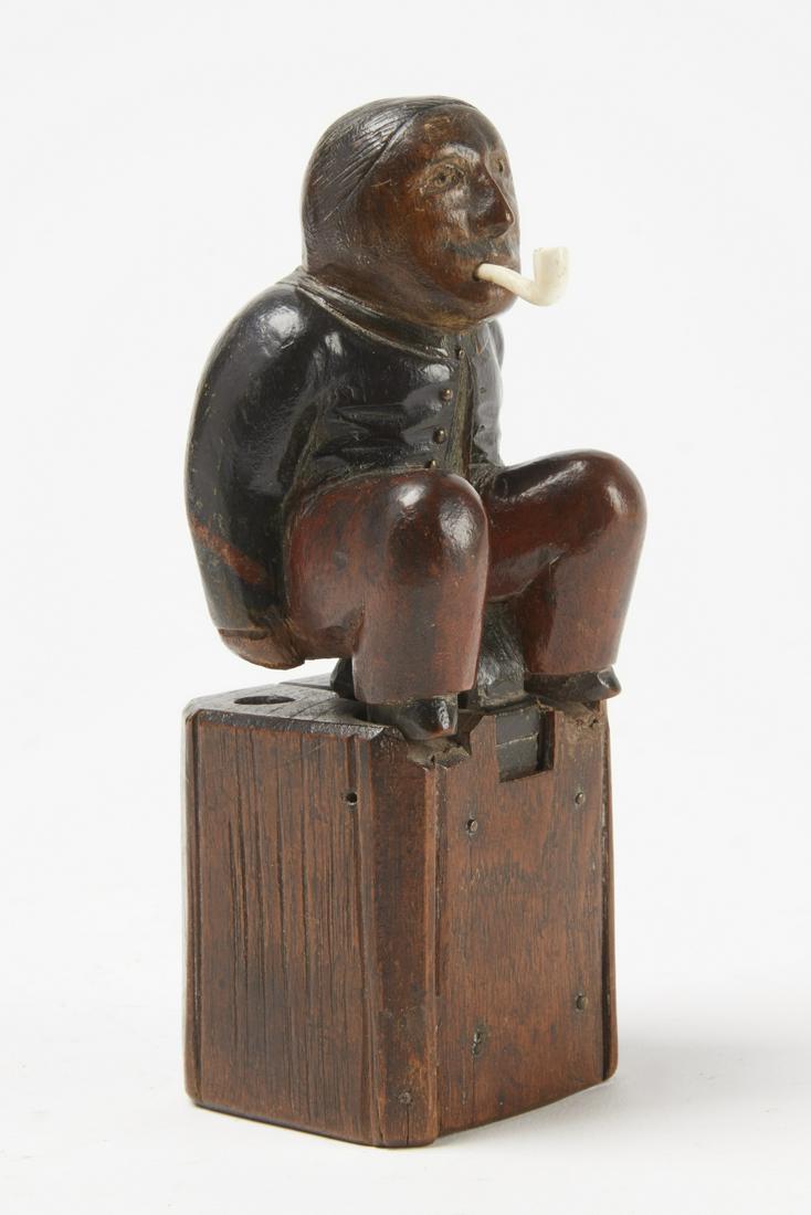 Fine Carved Folk Art Man Inkwell: Fine carved and painted folk art man, shitting inkwell. Carved wood with a carved bone pipe. Looks like walnut. American, circa 1860. H 7-1/2". Excellent original condition. Please refer to this link