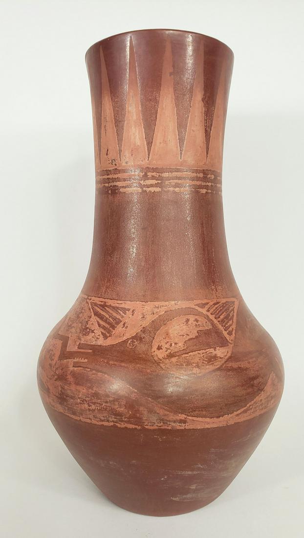 Large Juan and Tonita Roybal San Ildefonso Vase: Juan and Tonita Roybal San Ildefonso Vase. A large and boldly decorated Avanyu water serpent at the waist and sharp arrow tips surrounding the rim. Swags and shields fill the voids topping the serpent
