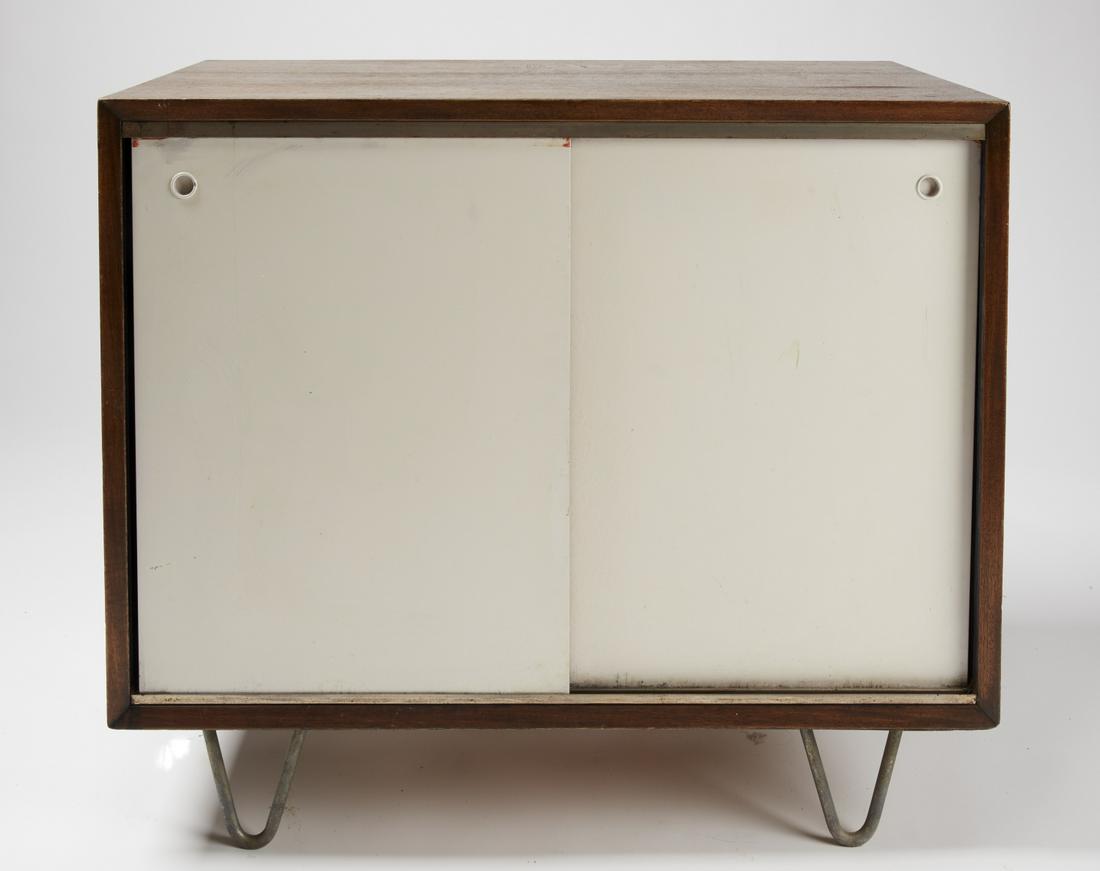 George Nelson Cabinet: George Nelson cabinet with sliding doors, circa 1960. L 34", H29-1/2", W 18-1/2". Excellent condition with minor imperfections.