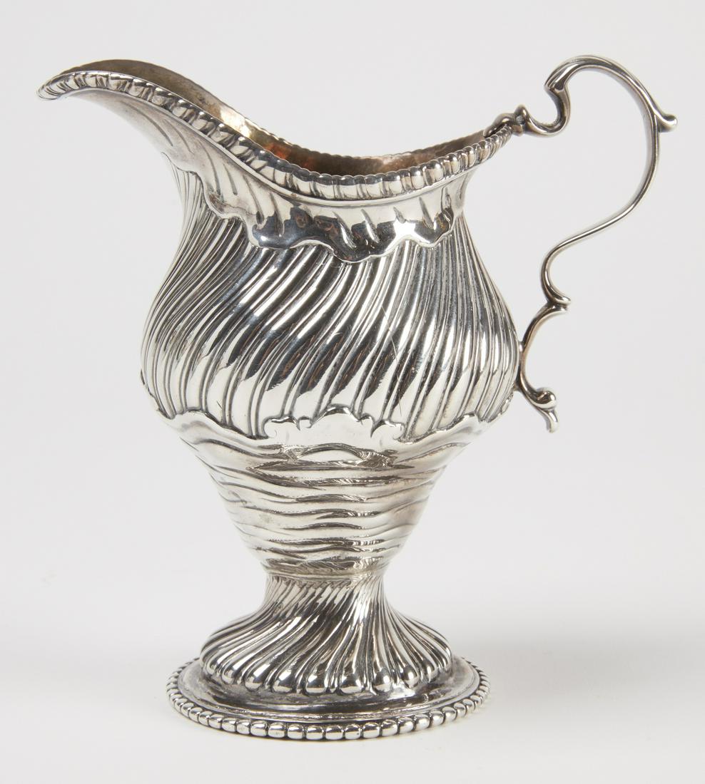 Rococo Georgian Silver Cream Pitcher: A Rococo Georgian silver cream pitcher with gold gilt interior. Augustin Le Sage, London , circa 1768. Weight 290 grams. H 5-1/2"