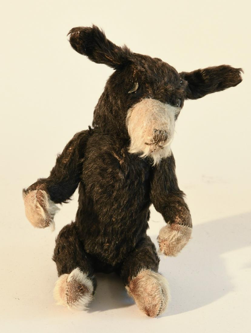 Black & Tan Jointed Teddy Bear: Black and white jointed Teddy Bear or dog, circa 1920. H 12". Minor imperfections.