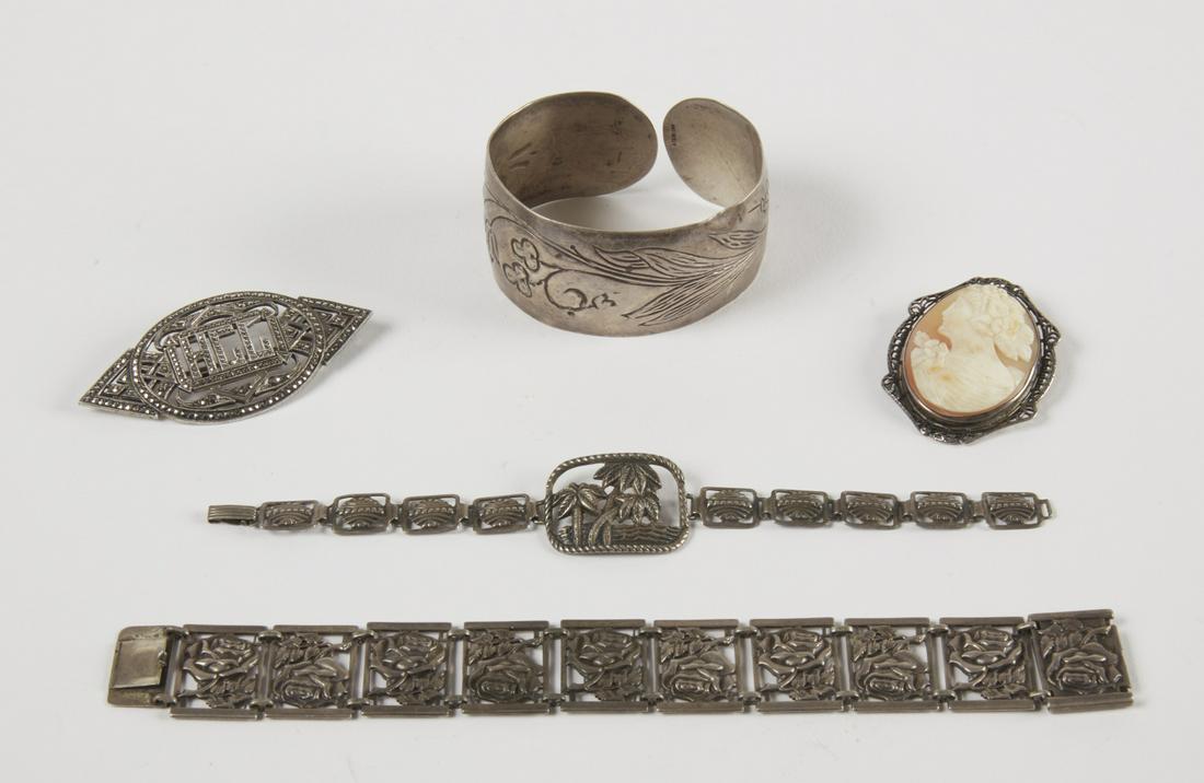 Vintage Sterling Jewelry Lot: Vintage sterling jewelry lot. Including sterling link bracelet with palm tree, sterling cuff bracelet with embossed flowers and leaves, sterling link bracelet with roses, sterling marcasite pin with i