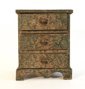 Miniature Blue Paper-Covered 3 Drawer Chest: Miniature well constructed paper covered three drawer chest. Square nailed construction. Nicely carved bracket base and edge molded top.Original brass pulls. Inscribed on the back and dated March 20,