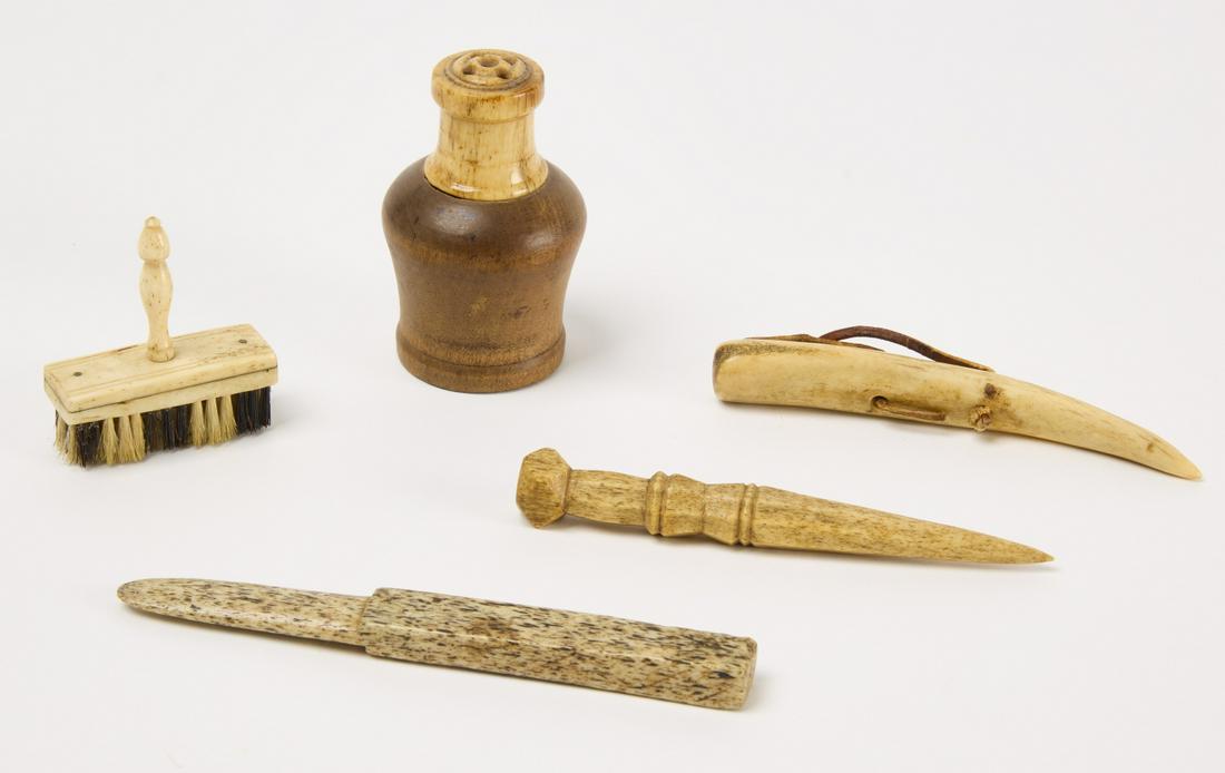 Lot of Five Bone Whaling Implements: Fine sailor-made scrimshaw items. 19th century. 1. Small brush H 2-1/4" W 2-1/16" D 11-1/16" 2. Small bone tool (like letter opener) H 5-1/2" W 9/16" D 3/8" 3. Awl H 4-3/4" W 9/16" D 1/2" 4. Wood shak