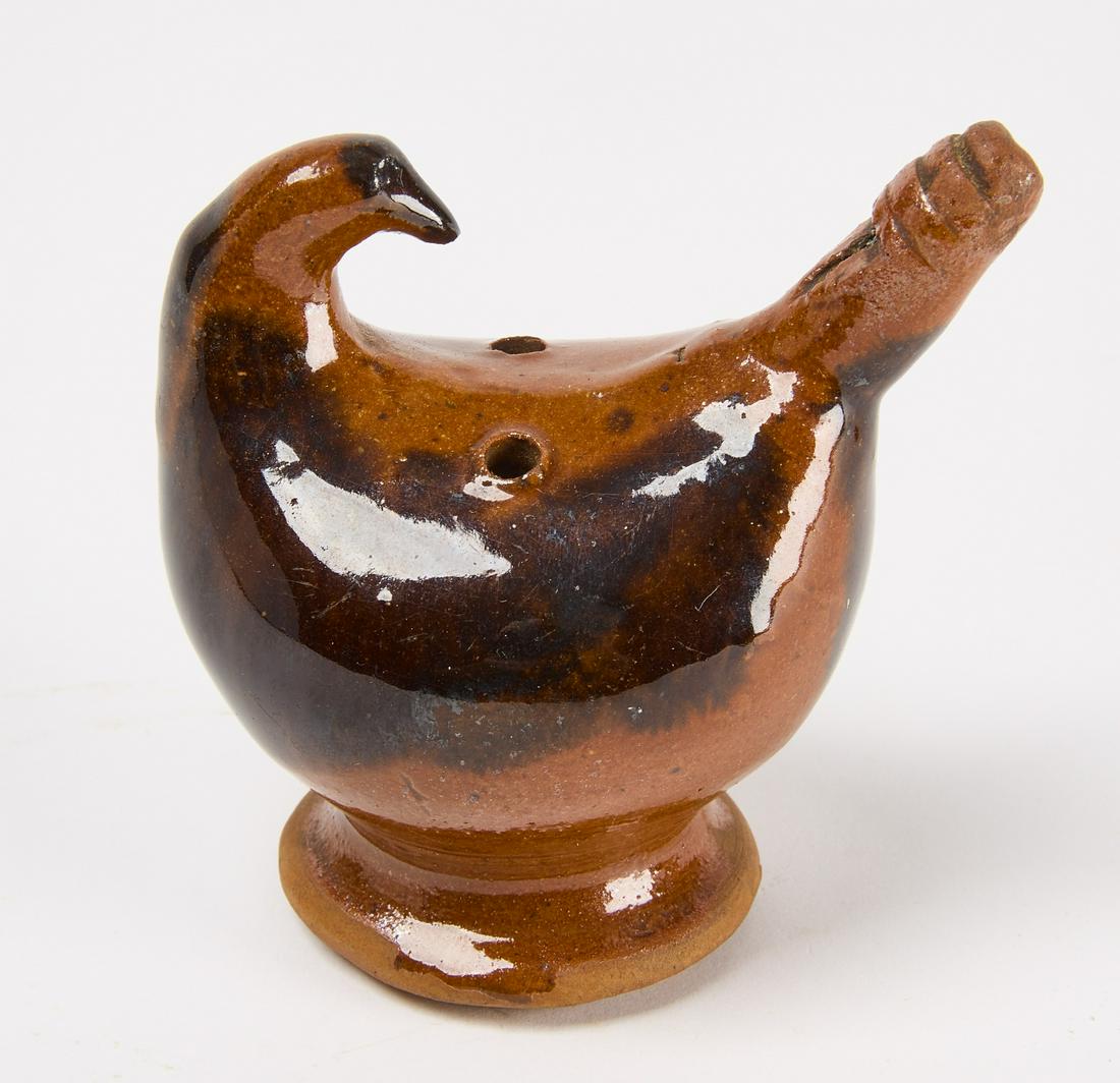 Redware Bird Whistle: Redware bird whistle. Pennsylvania, circa 1850. H 3-1/8" W 3" D 2" D base 1-3/4" Condition: Fine original condition. Provenance: Clark Garrett. Copy and paste this link for high-res images: https://ww