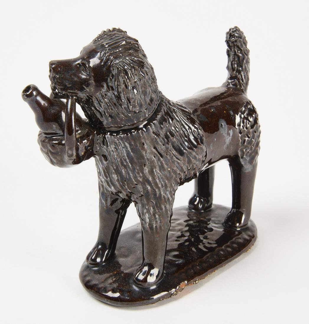 Redware Dog with Basket: Redware dog carrying a basket with jug. Probably Vickers Pottery. Chester Co., Pennsylvania, circa 1870. H 5-1/2" W 2-3/8 D 5-1/8". Condition: Fine original condition. Copy and paste this link for hig
