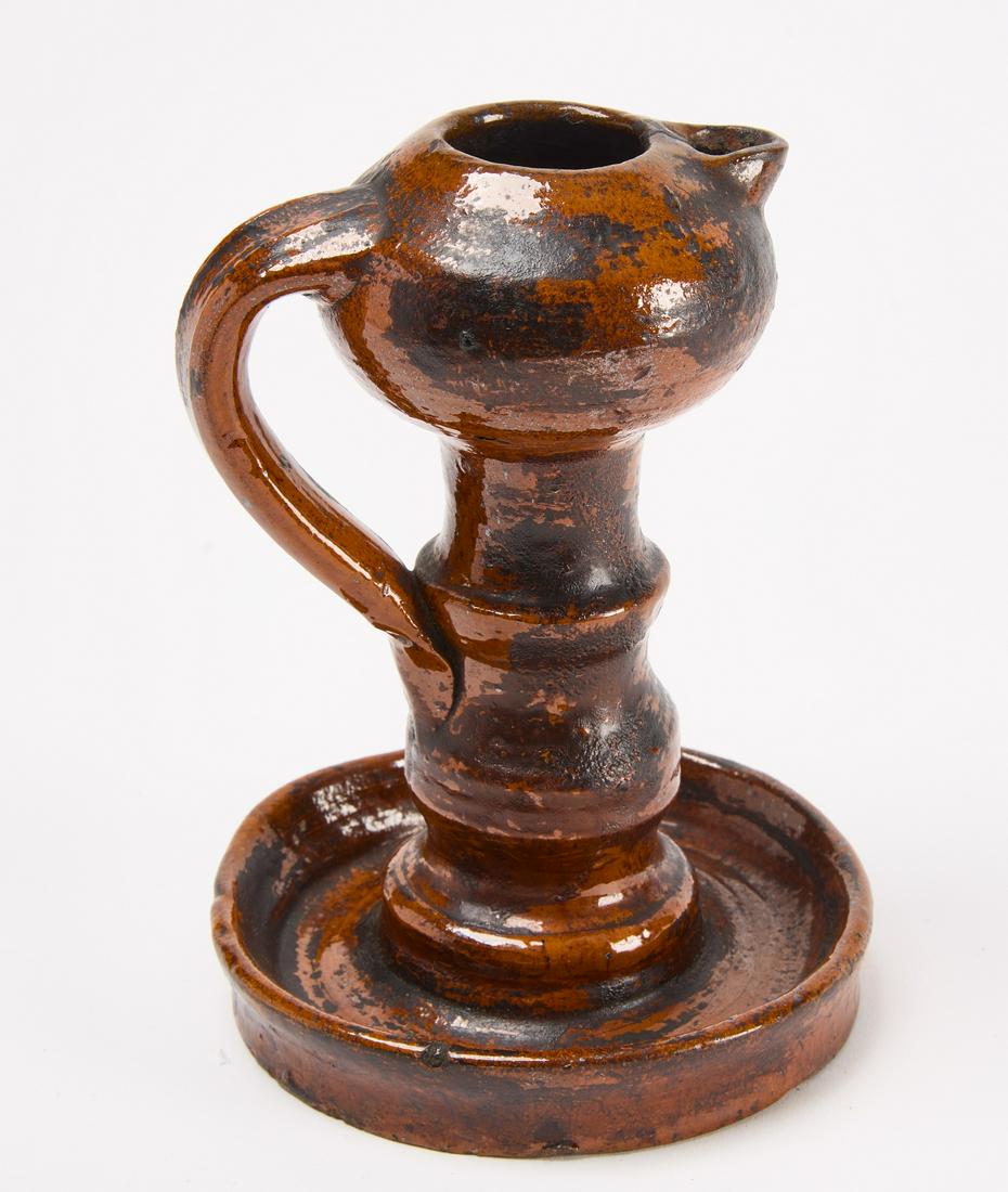 Redware Lamp: Redware lamp with bulbous reservoir. Illustrated, Central Pennsylvania Redware Pottery, by Jeannette Lasansky. Central Pennsylvania, mid 19th century. H 6-1/2" D (base) 4-1/2". Condition: Fine origina