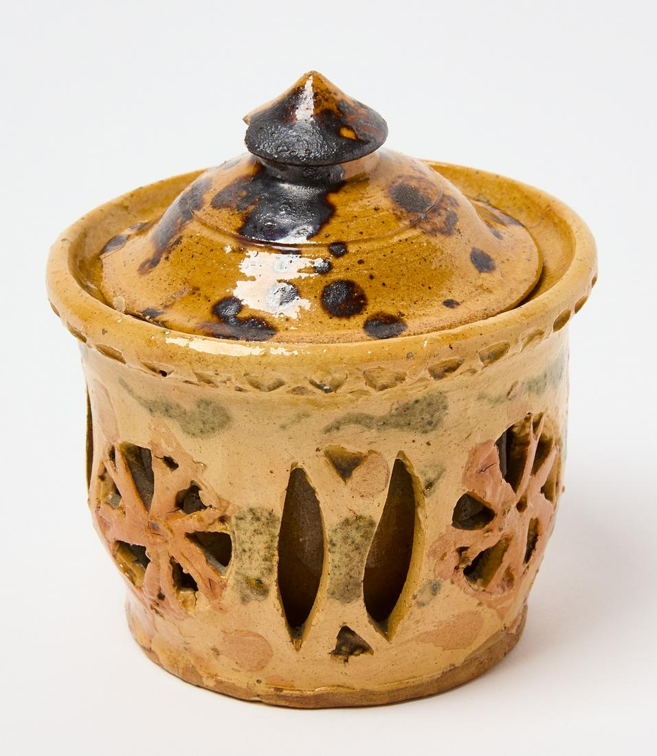 Redware Reticulated Covered Sugar: Redware reticulated covered sugar with unusual double walled cutaway design. Somerset Co., Pennsylvania, circa 1840. H (with lid) 5" H (without lid) 3-1/2". D (base) 3-3/8" D (rim) 4-3/8". Condition: