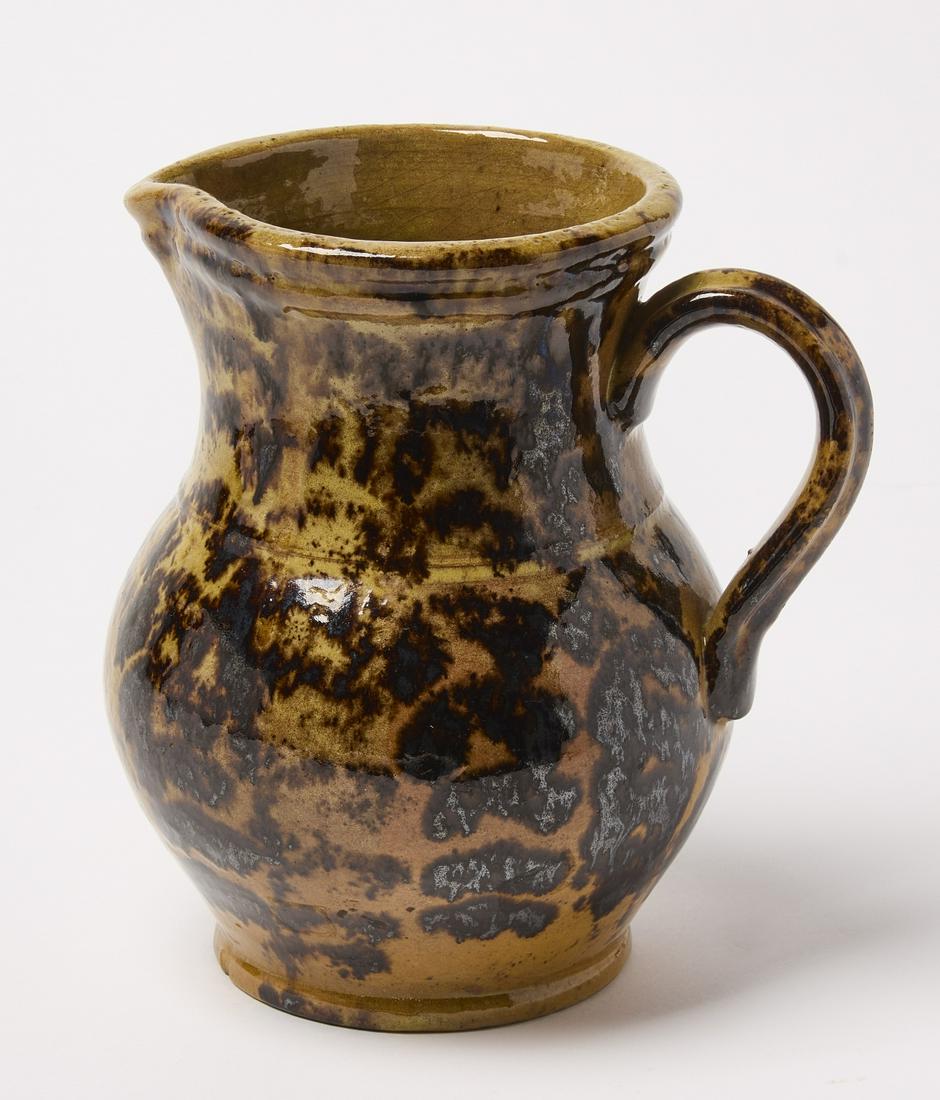 Southern Redware Pitcher: Redware pitcher. Attributed to John Bell family. Probably Virginia, circa 1870. H 8" D 7-1/8". Condition: Fine original condition. Minor base chip. Copy and paste this link for high-res images: https: