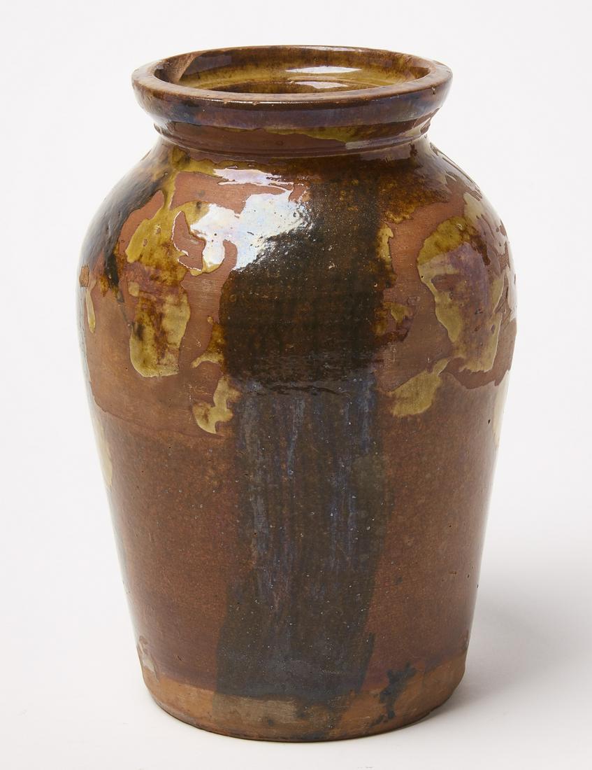 Redware Jar: Redware Jar, Alvin Wilcox. Signed with stamp. Yellow drip and manganese brushed decoration. West Bloomfield, New York, circa 1850-62. H 10" D 6-1/2". Condition: Excellent. A few rim chips. One chip is