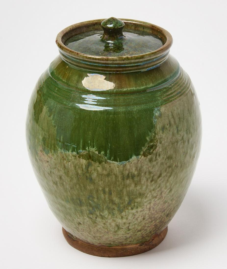 Green Redware Jar with Lid: Redware jar with lid. Green glaze. Massachusetts circa 1825. Provenance: Christies NY146 1-30. H 8-1/2", (with lid) D 6-1/4. Condition: Fine original condition. Provenance: Christies New York 146. Cop
