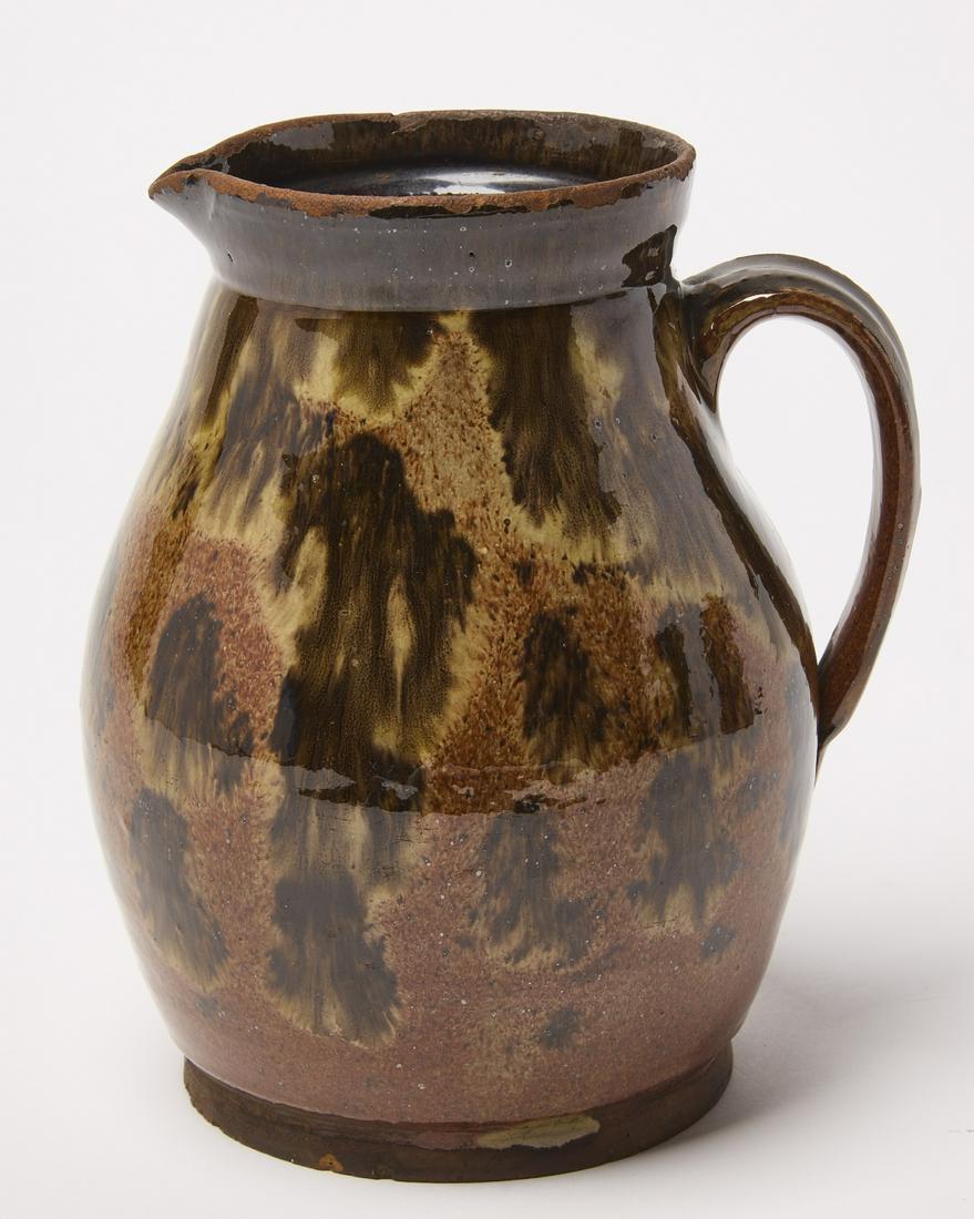 Redware Pitcher: Redware Pitcher. Corliss Family,. Yarmouth, Maine, circa 1820. H 6-1/2" D 5-3/4" (including handle) D 5-1/6" (without handle). Condition: Excellent original condition. very light chips to base. Glaze