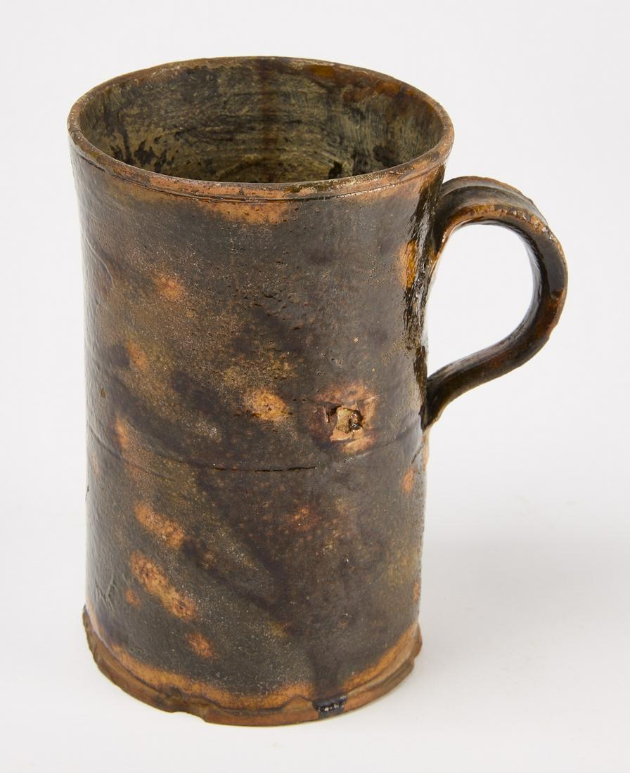 Tall Redware Mug: Tall redware mug. Hartford, Connecticut, 18th century. H 6-1/16" D widest (includes handle) 5-1/8" D top 4-1/8". Condition: Crack running down side opposite handle Copy and paste link for high-res ima
