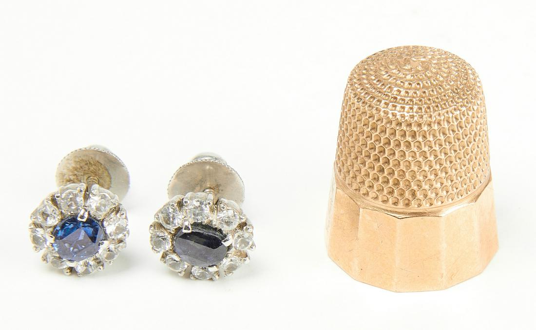 Thimble and Pair of Earrings: Gold thimble, together with a pair of earrings Gold thimble engraved with initials on side JMH. Acid tested 10Kt. Weight 2.8 dwt. Condition: Excellent condition. H 7/8" D 5/8". Oval pierced earrings w