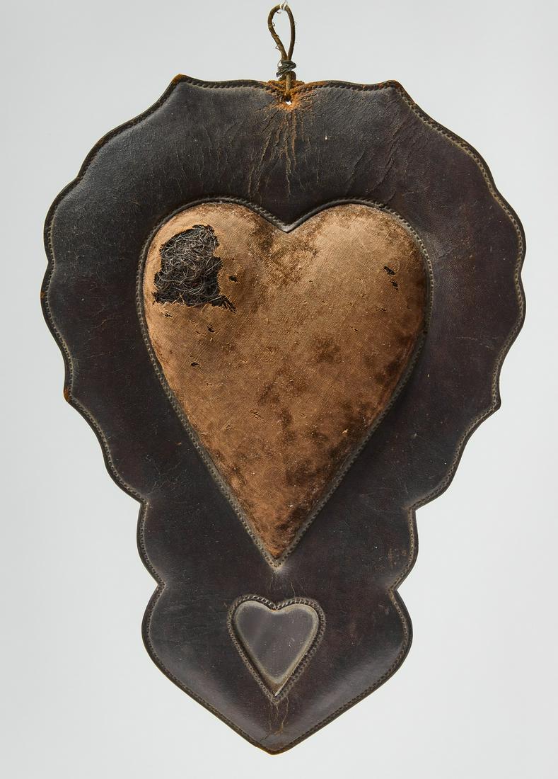 Leather Heart Pin Cushion: Leather heart horse hair filled pin cushion with inset heart mirror. Probably Virginia, mid 19th century. Condition: Excellent original condition. H 11-1/2" W 8". Copy and paste this link for high-res