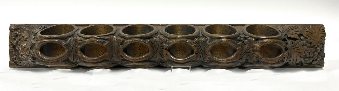 Wine Rack: Carved wooden wine rack with grapes. Stamped "Enkeboll" on back. Condition: Excellent. L 37-3/4" D 4-5/8" W 5-1/2".