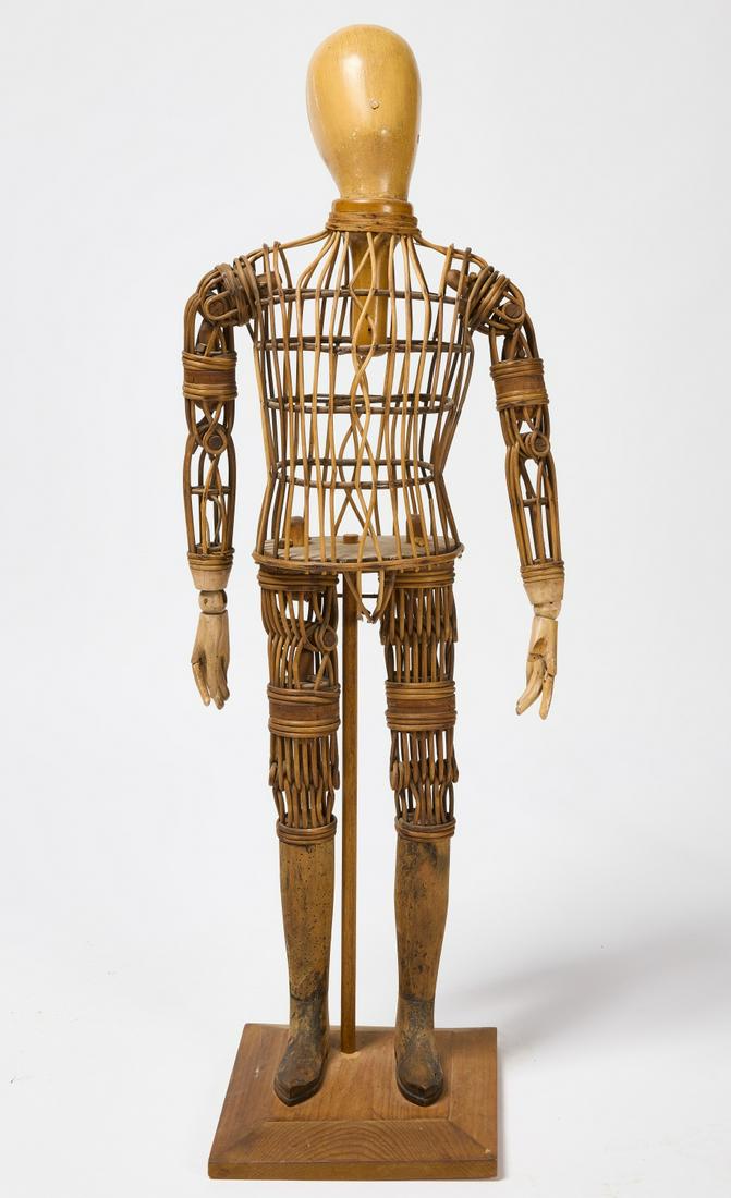 Boy Mannequin: Boy mannequin. Rattan and carved wood. 19th century. Condition: Minor losses and imperfections. Please review high-res link. H 44" W 15" D Base W 11-1/2" D 12". Copy and paste link for high res images