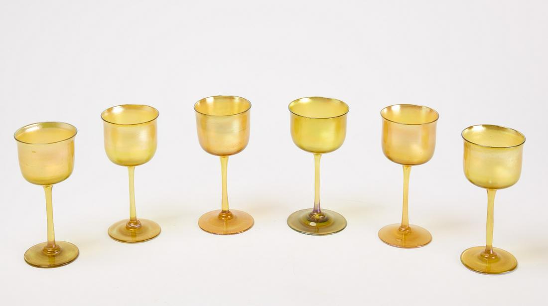 Six Tiffany Wine Glasses: Six Tiffany wine glasses. All signed L.C.T. Condition: Excellent, no damage noted. H 5-3/4". Copy and paste link for high-res images: https://www.dropbox.com/sh/xicgwz6221gionz/AACTqm6A56NG1K7fysErYRT