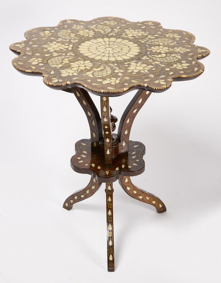 Table with Pearl, Brass, and Pewter Inlay: Table with mother of pearl, brass, and pewter inlay. Probably Morocco, early to mid 20th century. Condition: Excellent with very minor imperfections. H 29" W 25-1/2". Copy and paste link for high-res