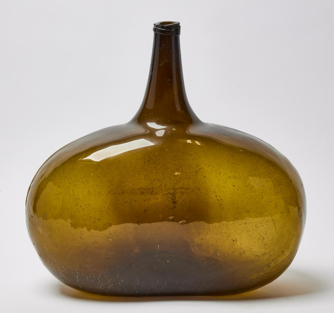 Green Glass Demi Jon: Green blown glass demi-jon. American, early to mid 19th century. Condition: No damage noted. Interior residue. H 18" W 17" D 9". https://www.dropbox.com/sh/cqyxng67obz11ui/AABCNkJSWMCHTwKz80GMQOO3a?dl