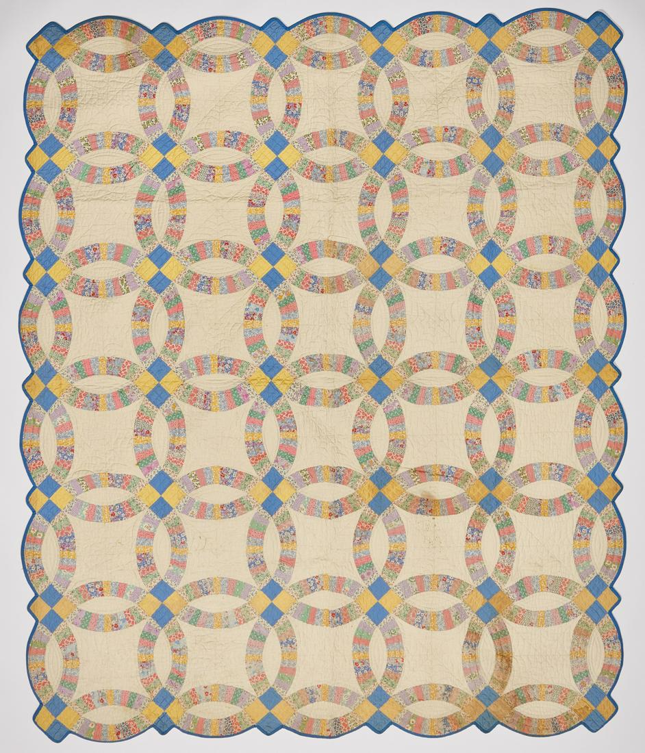 Wedding Ring Quilt: Wedding Ring Quilt Condition: Stain in upper middle area. H 88" W 73".