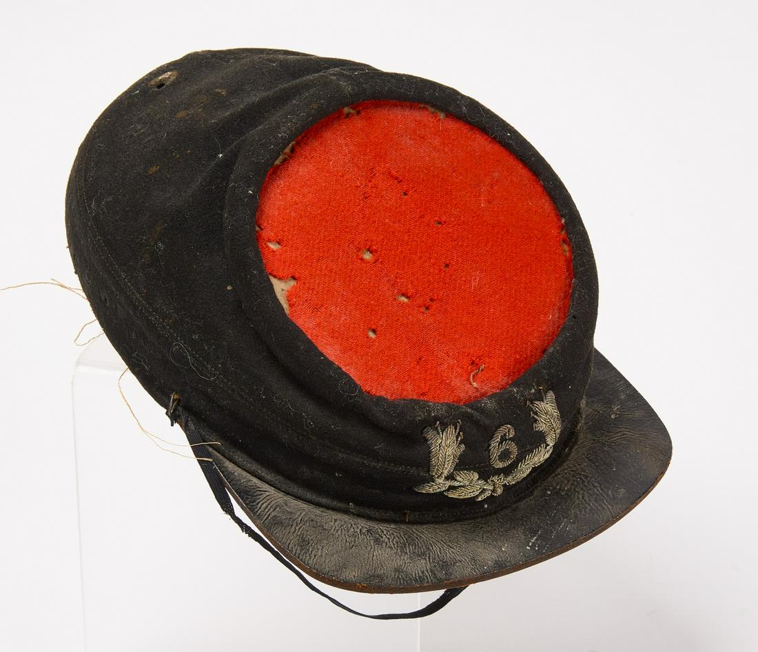 Early Military Hat: Early Military Hat with red top. '6' woven into front. Condition: Imperfections H 6-3/4" W 9-3/8" D 1-1/2".