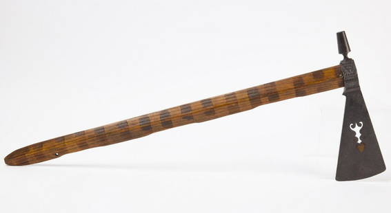 ''Native American Tomahawk Peace Pipe: Native American peace pipe tomahawk with inlaid brass hearts and stamp decorated handle. 19th century. L 30" Blade L 7-1/4" W 4-1/4". Condition: Original condition.