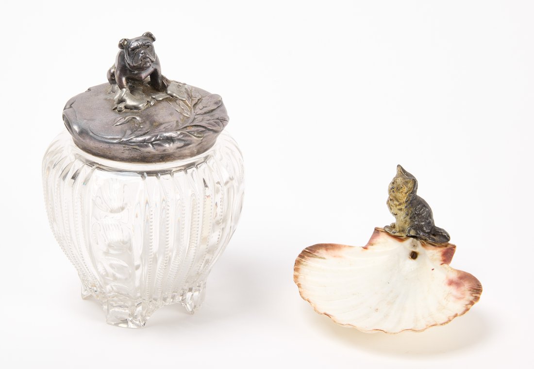 Seashell Dish and Bulldog Cookie Jar: Seashell dish with cold painted metal cat.H 3-7/8" L 5". Together with a bulldog cut glass cookie jar with silver plated lid. Condition: Old solder repair around base of dog. H 8".Link for high-res im