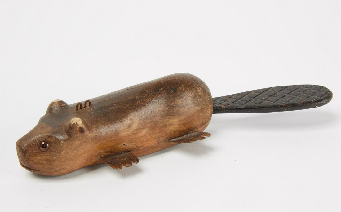 Beaver Decoy: Small beaver decoy with moveable tail. Carved wood. American. 20th century. H 10" W 3-1/8". Condition: Original condition. Copy and paste link for high-res images: https://www.dropbox.com/sh/p2tc950mm