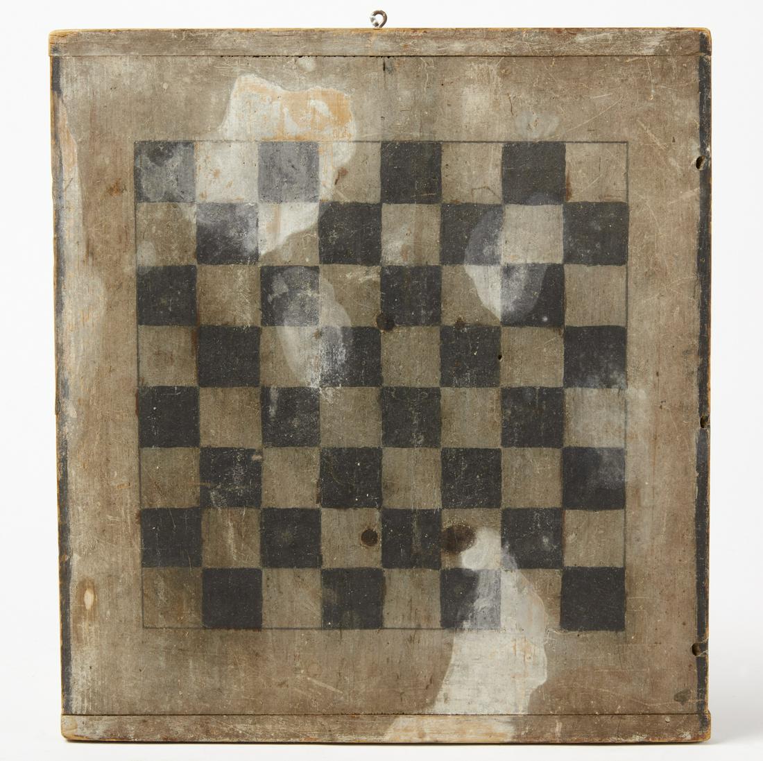 Checkerboard: Checkerboard in black and white paint. 19th century. One piece pine with breadboard ends. H 14-3/4" W 13-1/2". Provenance: Newburyport, Mass. estate sale, 1991 Condition: Very good original condition 