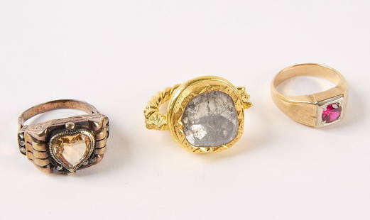 Three 14K Gold Rings: Three 14k gold rings, 1) 14k gold and flat rose cut diamond. Contemporary ring. 9.46 dwt. 2) 14k gold and heart shaped topaz with eight small rose cut diamond accents. 5.43 dwt. 3) 14k yellow gold and