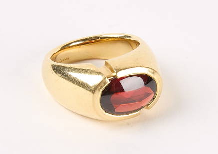 18K Yellow Gold and Oval Garnet Ring: 18k yellow gold and oval garnet ring, contemporary. Size 8.75. Engraved with 18k and name in script hard to read name. Total weight: 17.06 dwt. Descriptions, weights, sizes and conditions are our best